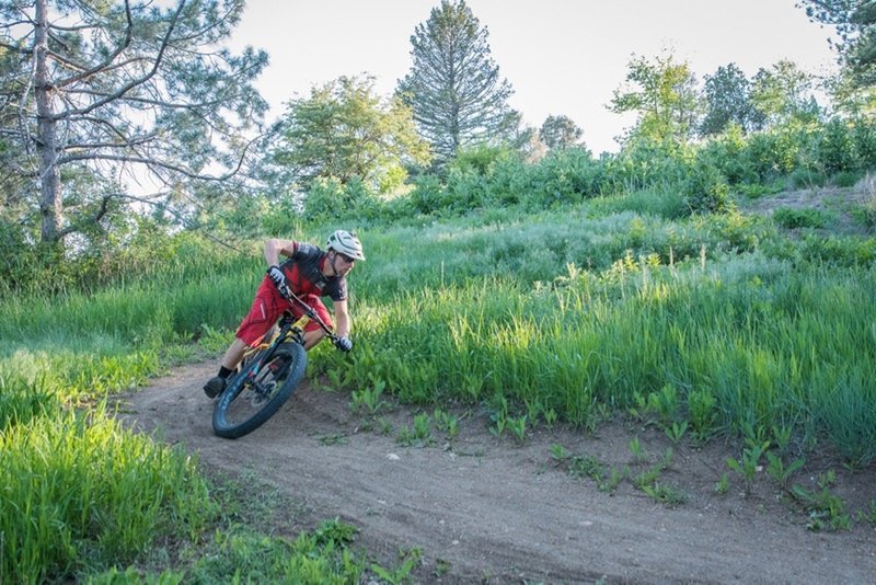 Riding one of the downhill singletrack switchbacks on the XC loop. Off-camber, loose over hardparck, FUN!