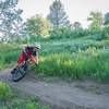 Riding one of the downhill singletrack switchbacks on the XC loop. Off-camber, loose over hardparck, FUN!