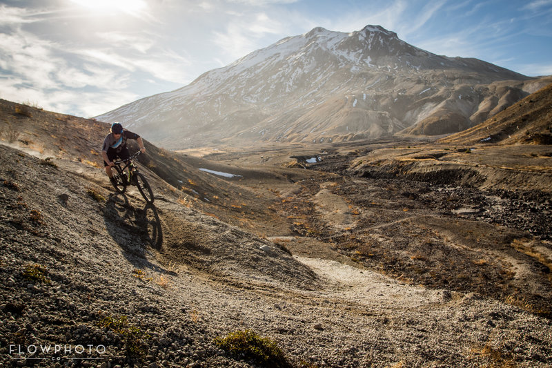 Cody Olsen holding a corner in the Plains of Abraham, lots of pebble like pumice terrain. Very different to ride on.