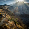 Cody Olsen races the sun as Mount St. Helens looms over the valley of death. Seen to the right is the famous explosive face where the landslide and explosion happened.