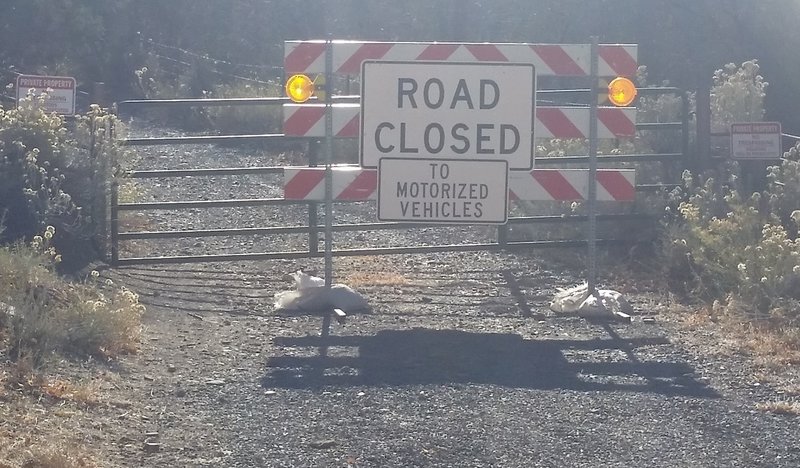 Unusually confusing Road Closed sign on public right-of-way just before the dilapidated bridge.  Bike through but don't park here! Park at Buzzard Gulch trailhead to avoid issues with landowners.