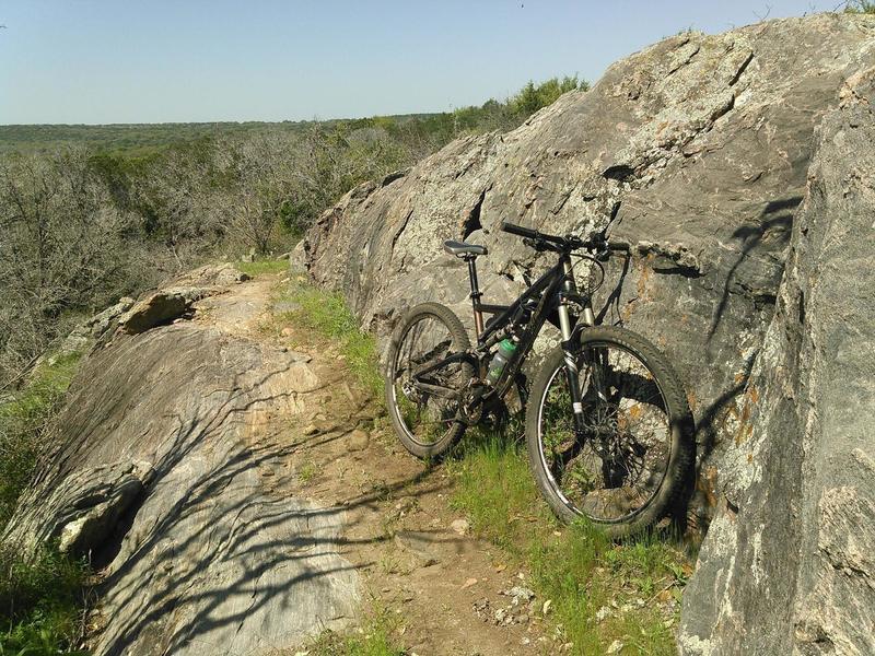 Riding atop 1.2 billion year old Packsaddle Schist along the forgotten section of the Race Loop