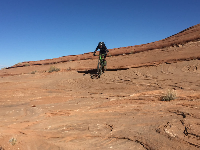 Dropping some slickrock ledges.