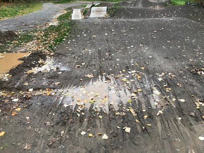 Puddle and rutting on the drop in to the Skills area of Gateway Green; CLOSED until further notice.