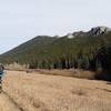 Chris pops a wheelie on the way up Mule Deer Trail with great views of the rocky ridgeline