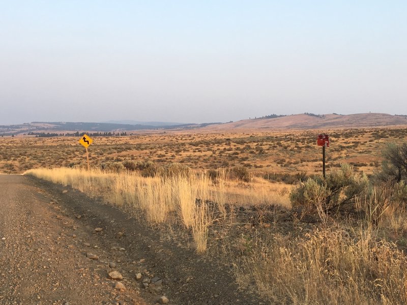 Parking for Manastash Backside trails.  Look for the trail behind the shot up "Fiber optic" sign shown here.