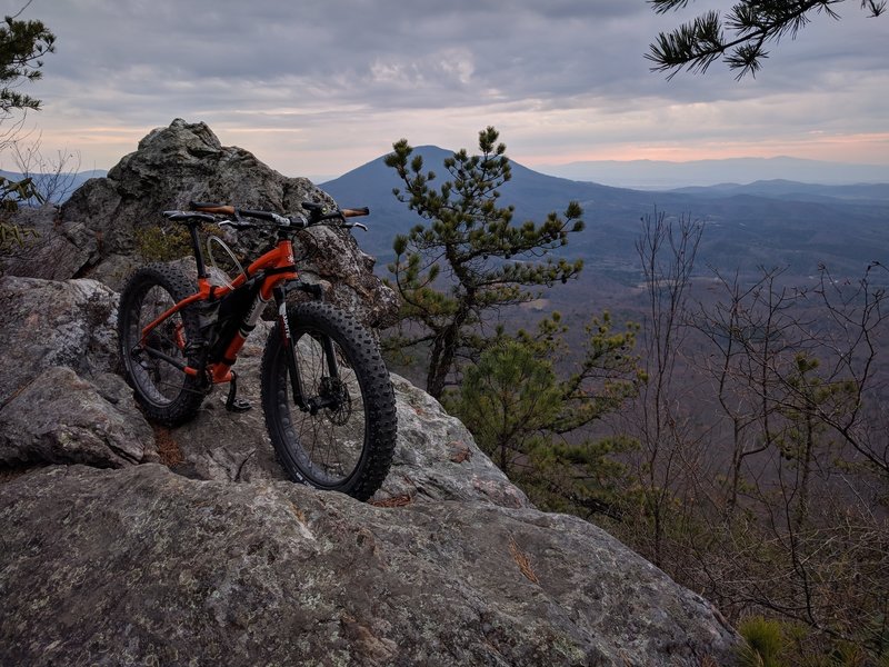 Fatty takes a rest while I capture Big House Mountain to the east (background). The climbing isn't finished; enjoy a bit of rest at these vista overlooks and regain your strength!!