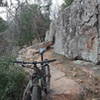 A rocky, ledge and stairstep climb along a section of the Race Loop reroute