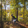 Tight singletrack and a sharp turn located on a steep rocky shoulder overlooks Philpott Lake down below.