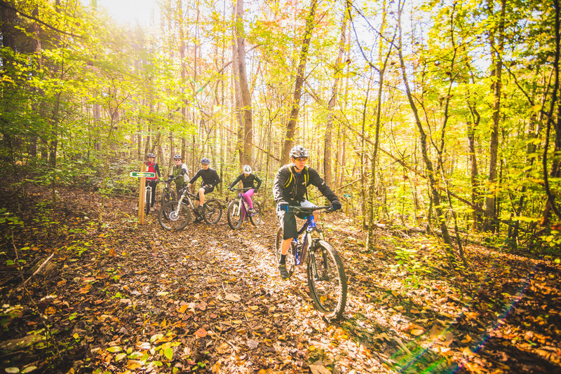 Riders meet at trail intersection Ridge Access Trail and Golden Shores