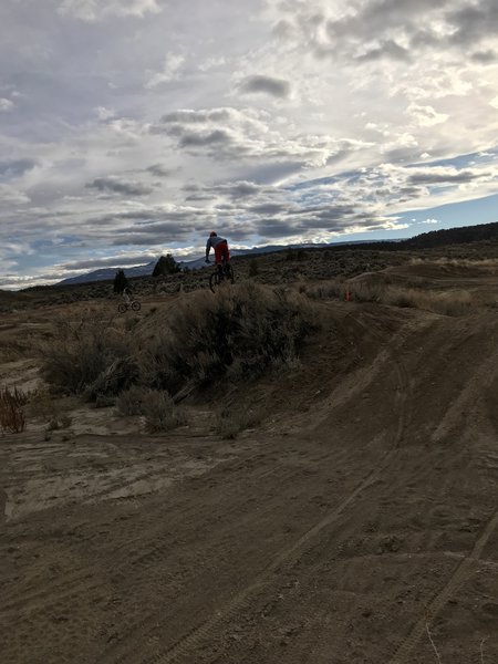 Popping out of the Junipers and over 2 obvious dirt mounds - can be muddy here if wet