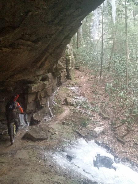 Trail goes under many rock houses.