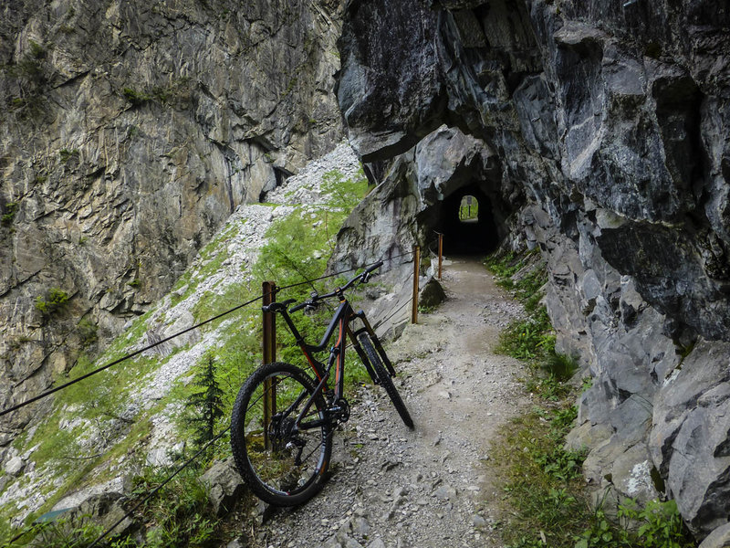 Ride a cliff blasted in and through the side of the mountain