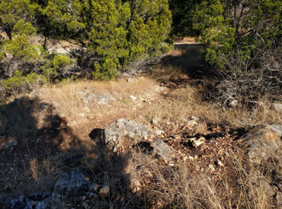A rocky descent leading to a climb.