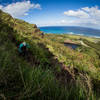 The trail meanders on a steep steep side slope overlooking the gorgeous turquoise Pacific Ocean.