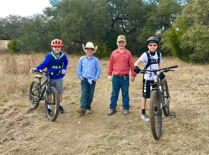 Mountain Bikers and Cowboys share the trail at Dripping Springs Ranch :)