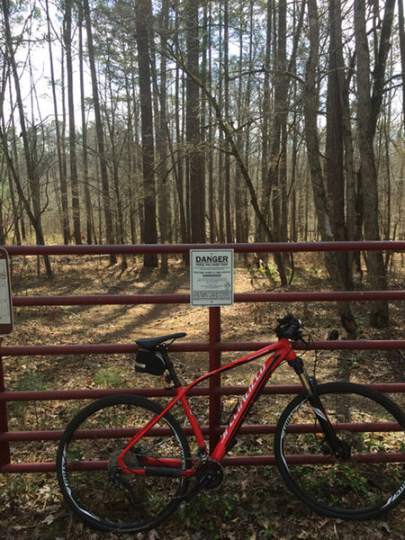 Signs warn of feral pig trapping, and not to approach trapped animals. Wild boar are a common site on this trail.