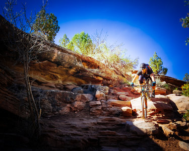 Dropping into the rock ledges. Has been cleaned up so its all rideable