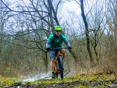 Riding through a muddy section of  Field Trail
