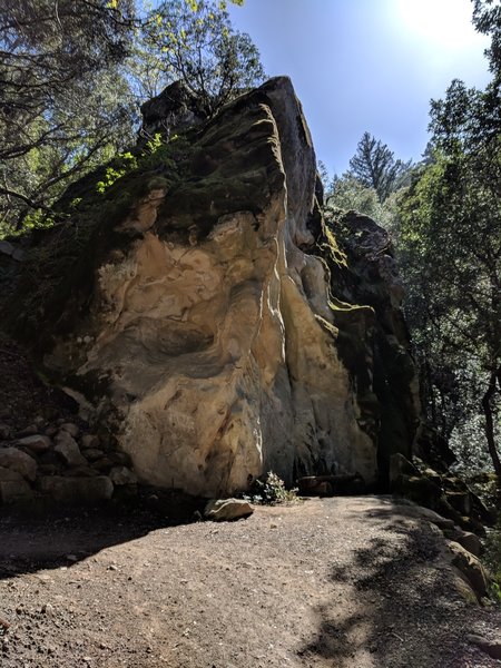 A large rock with a nice bench makes a good rest stop.