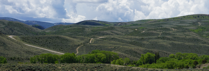 Finley Hill Road can be seen winding up the hills outside of Encampment.