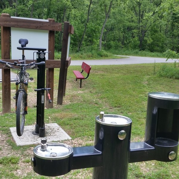 A bike repair station and drinking water on the trail.