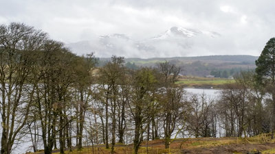 Snow-capped hills through the mist