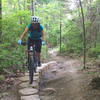 Rie rides stumpy alt line on Perimeter Trail