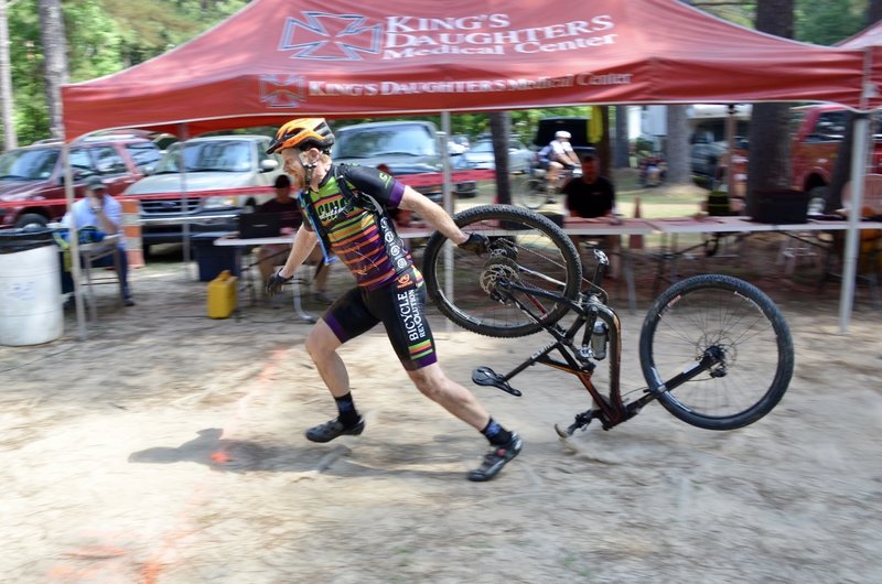 the first one to cross the finish line WITH his bike...won the position