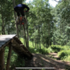 Sending it over one of the fun wood features on this fun downhill trail section