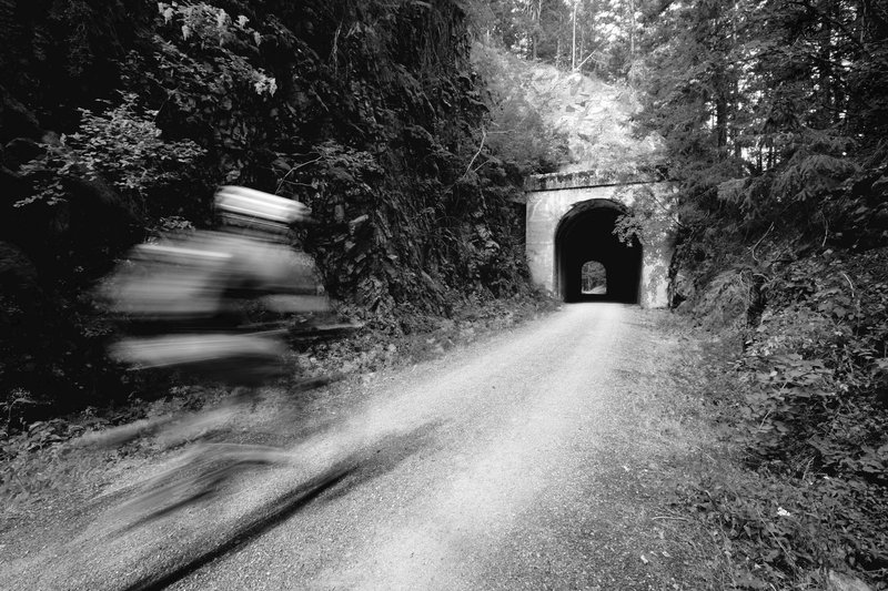 Riding toward Tunnel #48 on the John Wayne Pioneer Trail.