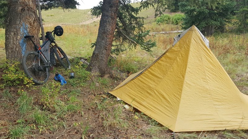 Getting chased by hail, finally pulled out the tent at the last cluster of trees.