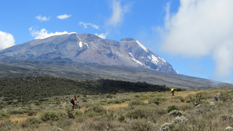 Philip and Rasta climbing Kilimanjaro in a 2017 recce of what would become day one of the 2018 K2N MTB Stage Race.