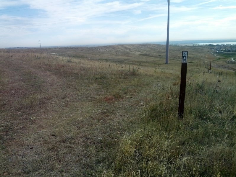 Trail junction by the fence on top of the mesa.