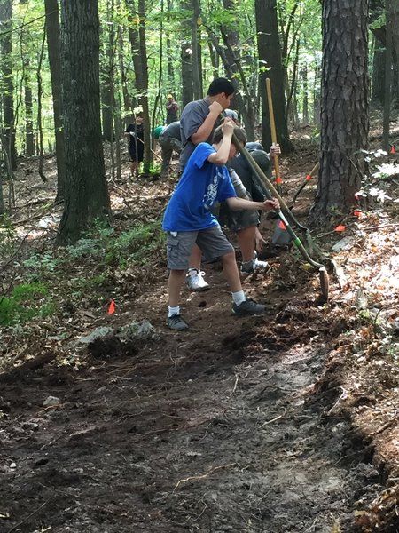 Boy Scouts working with bike and trail running group putting in the work for a great trail!