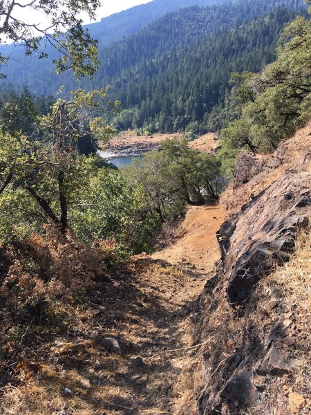 An exposed section of trail along the Rogue River.