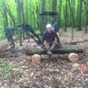 Building a new bench, "Greg's Rest", for a view of Winnewana Lake. Kevin Marzhal, Spectrum Trail Design machine operator.