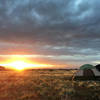 Looking east at the April sunrise from Lone Mesa campground. Fell asleep to the sound of rain on the tent and woke up to the promise of tacky dirt and slickrock.