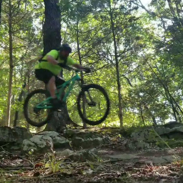 Jumping off one of two drops along the top of the ridge. Downhill awesomeness commences directly after.