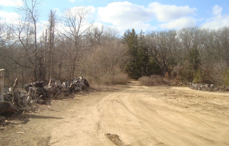 Parking area at east side of 121st Avenue accessed from 46th Street.