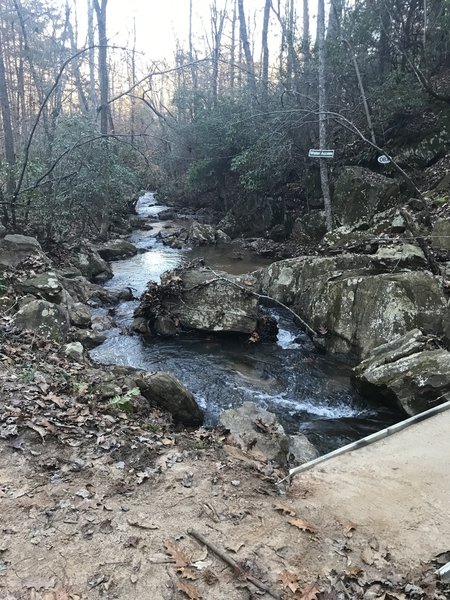 Bridge by small waterfalls.