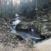 Bridge by small waterfalls.