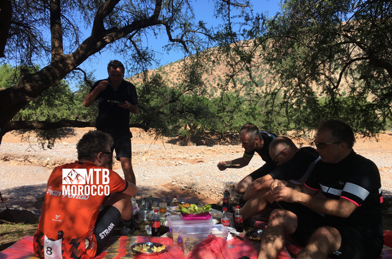 Lunchtime in Morocco under the trees of Argan, sharing culture with locals.