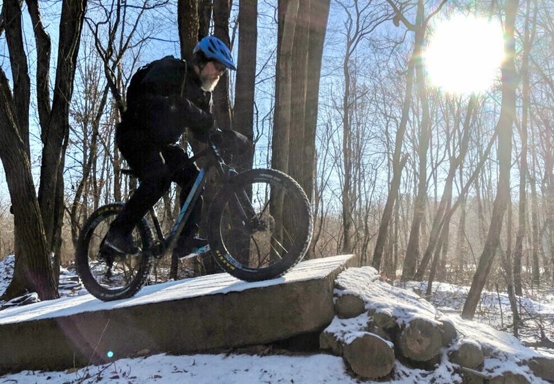 WG rides an off-camber concrete slab on KA-BAR trail.