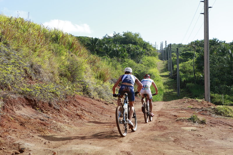 Pro XTERRA athletes, Ben Allen and Dan Hugo, follow the Power Line trail up the Grass Wall climb. Photo by Takamitsu Usami