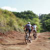 Pro XTERRA athletes, Ben Allen and Dan Hugo, follow the Power Line trail up the Grass Wall climb. Photo by Takamitsu Usami