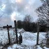 Passing through a gated field entrance on the Backbone trail in Finger Lakes National Forest.