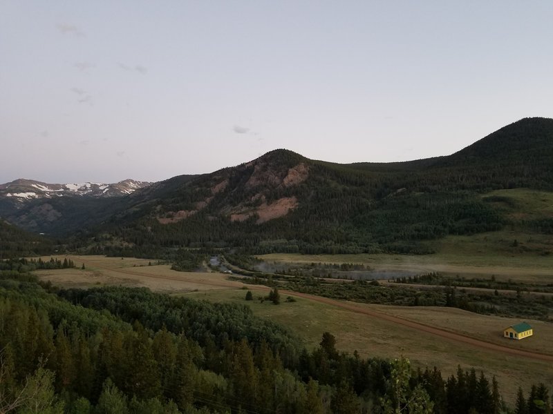 The Divide, South Boulder Creek, Tolland Road, the old school house, and Rollins Pass Road climbing the far mountain from the campsite on 4-N