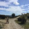 Looking south at the crossroads, with the indistinct start of the singletrack leading to Boulbon on the right.