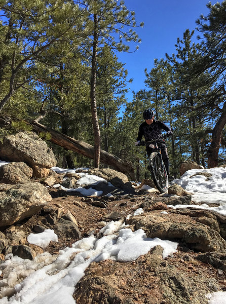 Rocky turn continuing onto snow.